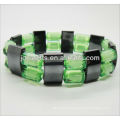 Magnetic spacer bracelet with green plastic beads